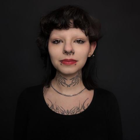 Septum and lower lip piercing combination with a bold, alternative finish. The jewellery creates a strong facial accent while keeping the placement balanced, with sterile technique and clear aftercare guidance.